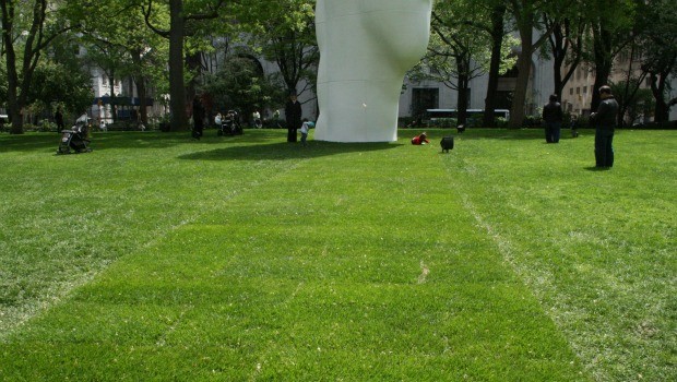 The Madison Square Park Conservancy rolled out what seemed like a green carpet (of grass) for the statue. It took three full days to install.